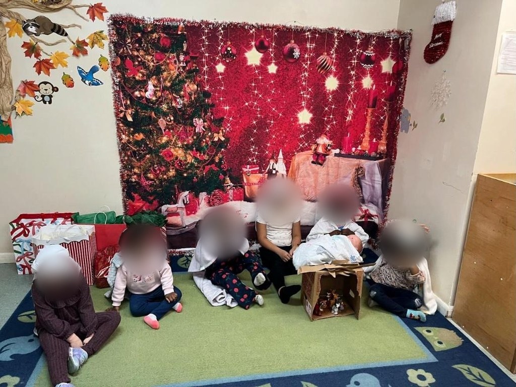 Children sitting on the carpet during the Bright Starts Christmas program
