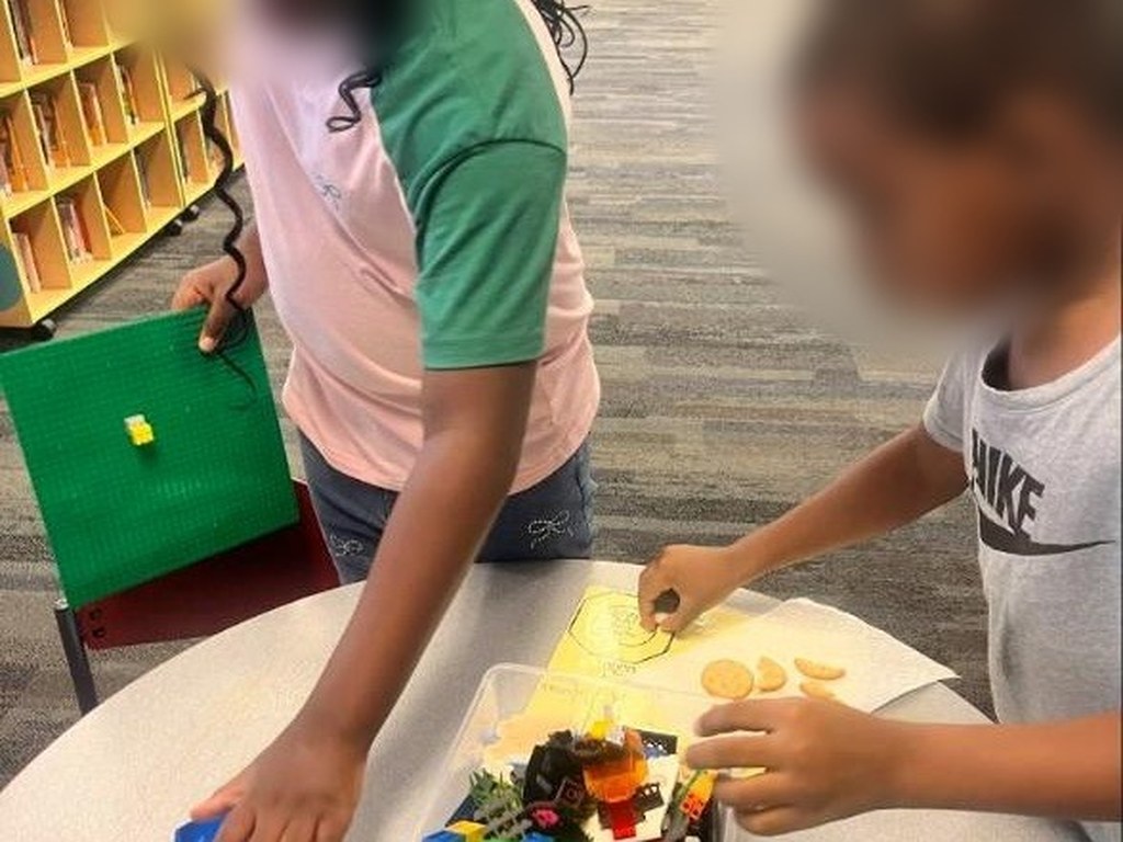 School-age children building with blocks on a library visit